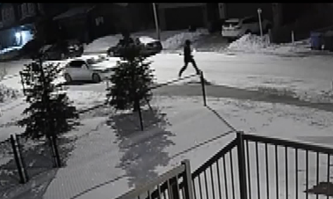 This photo, taken from CCTV footage appears to show a suspect running away from the scene of one of the 18 extortion shootings police say have taken place.