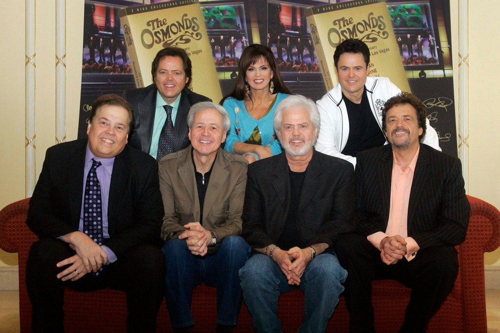 American band 'The Osmonds' from left front row, Alan, Wayne, Merrill, Jay, back row from left Jimmy, Marie, Donny pose for photographers at a media event in London, Thursday, May 29, 2008.