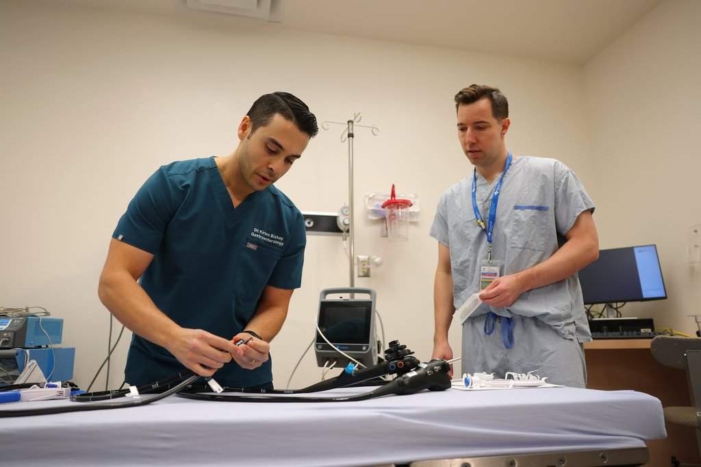 Gastroenterologist Dr. Kirles Bishay, left, and upper gastrointestinal and bariatric surgeon Dr. Noah Switzer, explain the equipment they use for endoscopic sleeve gastroplasty procedures at The Royal Alexandra Hospital in Edmonton on Wednesday, May 27, 2026.