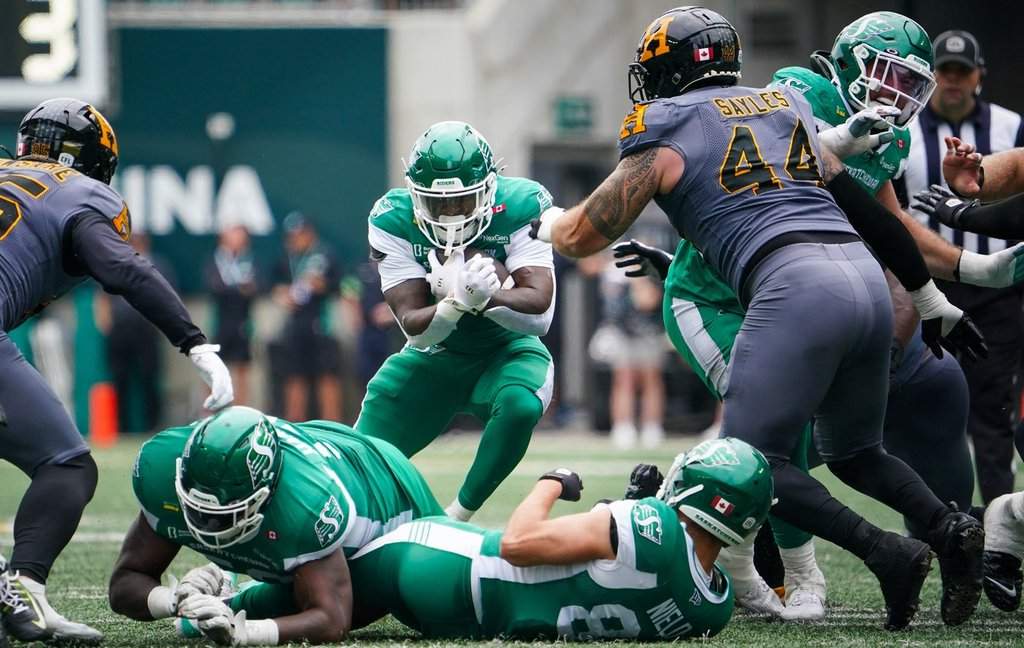 Saskatchewan Roughriders running back Mario Anderson Jr. (24) runs the football against the Hamilton Tiger-Cats during the first half of CFL football action in Regina, Saturday, Aug. 16, 2025. THE CANADIAN PRESS/Heywood Yu.