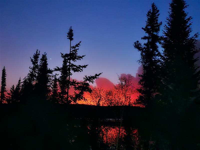 The wildfire across the lake from Pat and Russ Popp’s home last spring.