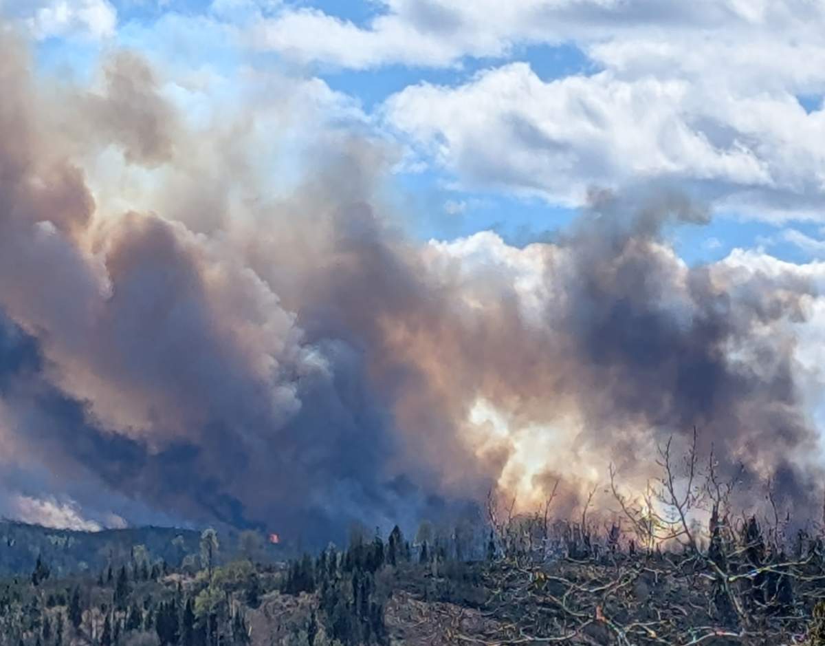 An out-of-control wildfire, burning about 30 kilometres northwest of Sundre, has prompted an evacuation alert to be issued for the area.