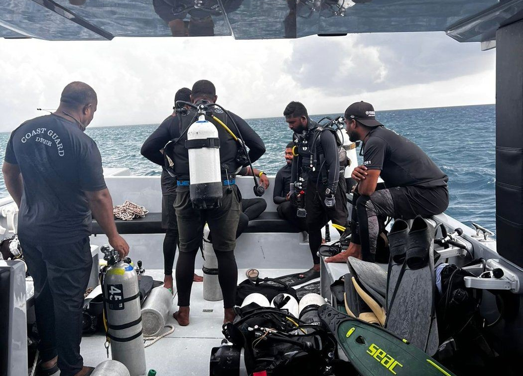 This photograph shared by the Maldives President's Media Division, shows divers preparing to search for the four missing Italian divers near Alimathaa Island, Vaavu Atoll, Maldives, Saturday, May 15, 2026. 
