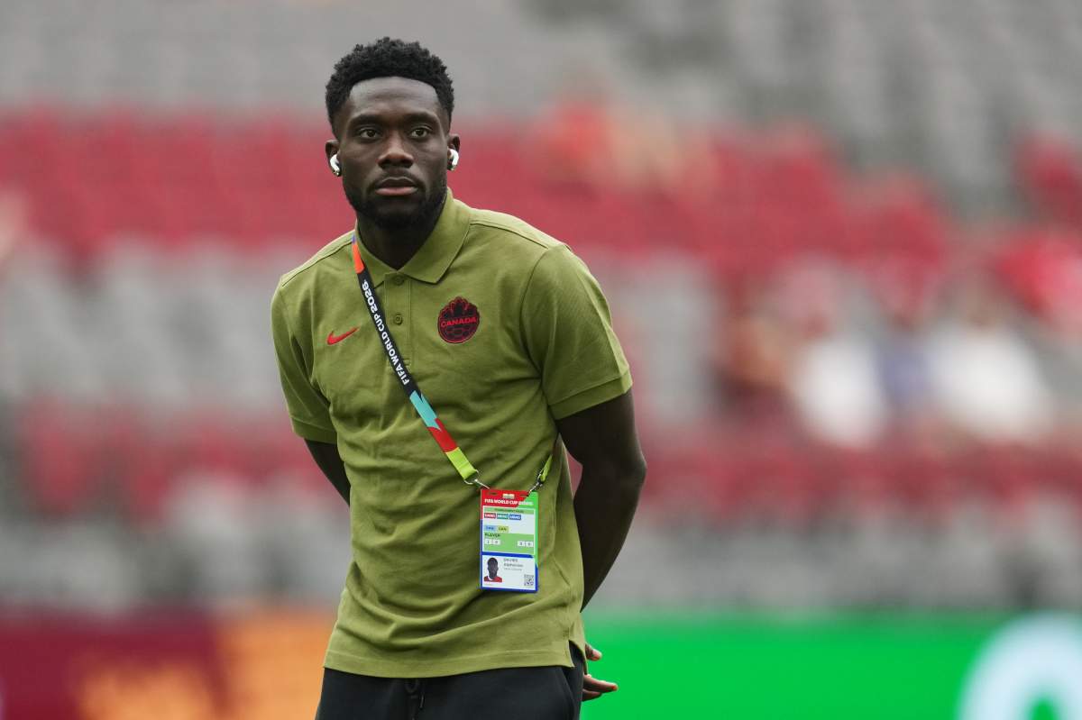 Canada's Alphonso Davies walks on the pitch as his team arrives prior to the World Cup Group B soccer match against Qatar in Vancouver, British Columbia, Thursday, June 18, 2026. (AP Photo/Abbie Parr)