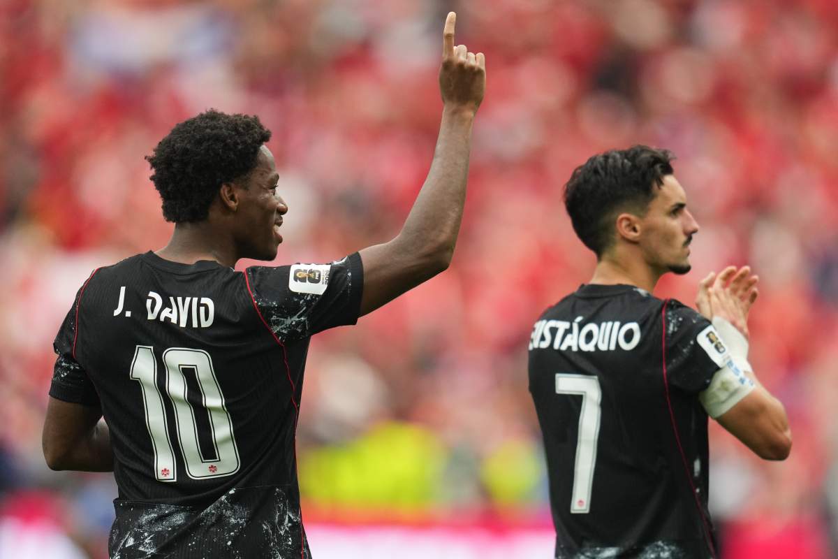 Canada's Jonathan David, left, and Stephen Eustaquio celebrate their team's win in the World Cup Group B soccer match against Qatar in Vancouver, British Columbia, Thursday, June 18, 2026.
