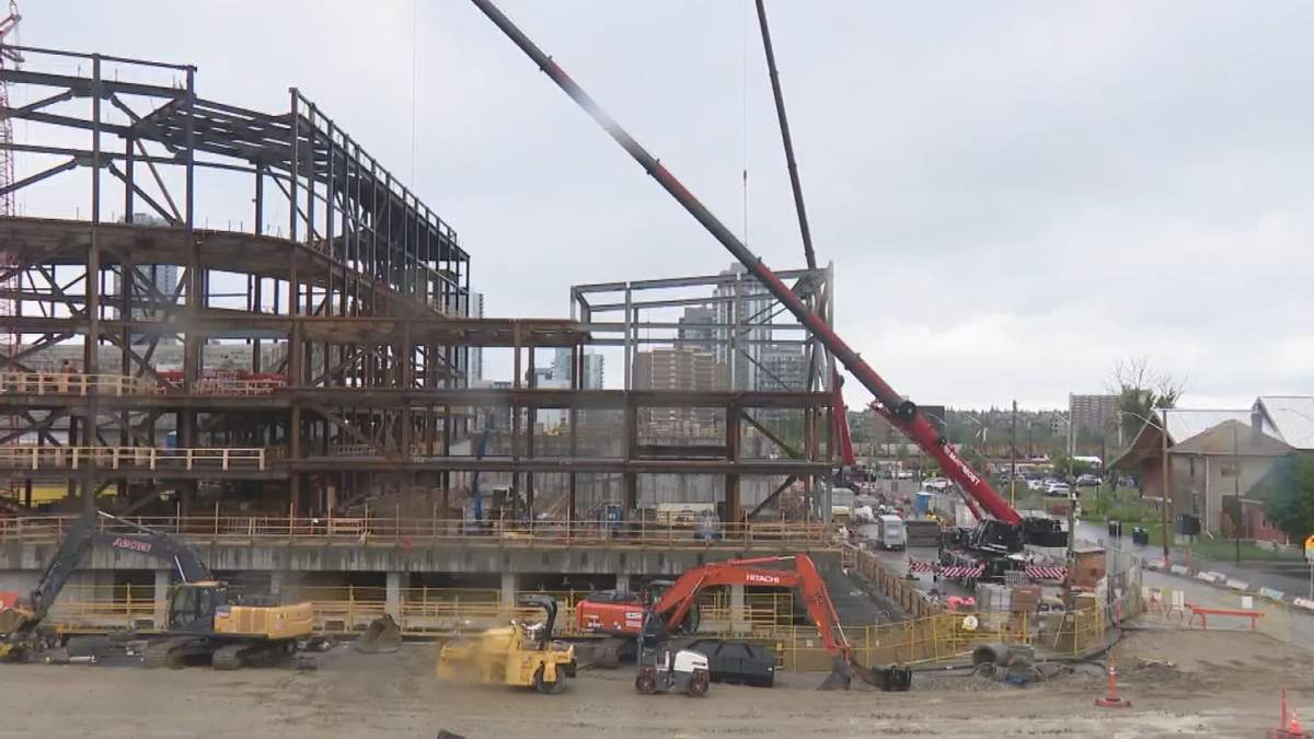 Cranes hover over the east side of the unfinished Scotia Place project in Calgary, Alta., on June 2 2026.