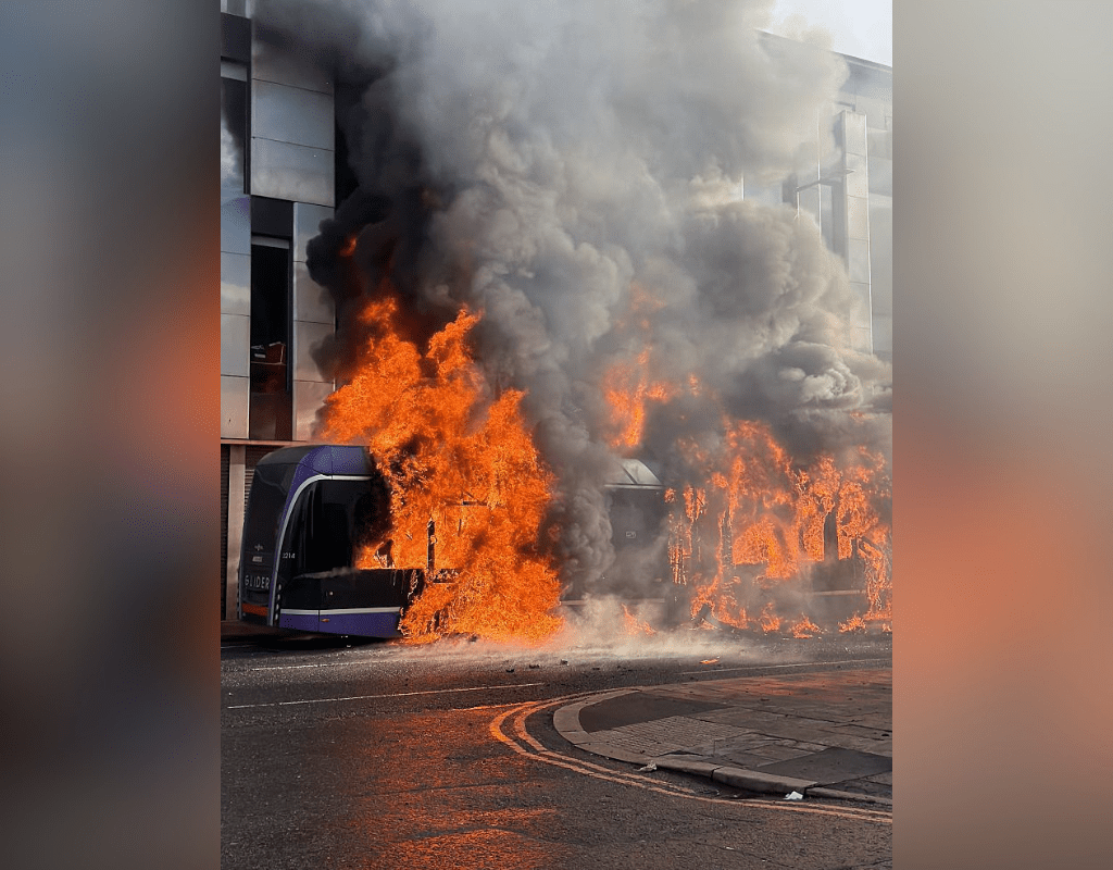 BELFAST, NORTHERN IRELAND - JUNE 09: Flames and thick black smoke rise from a burning bus during unrest on Sandy Row in Belfast, Northern Ireland, on June 9, 2026.