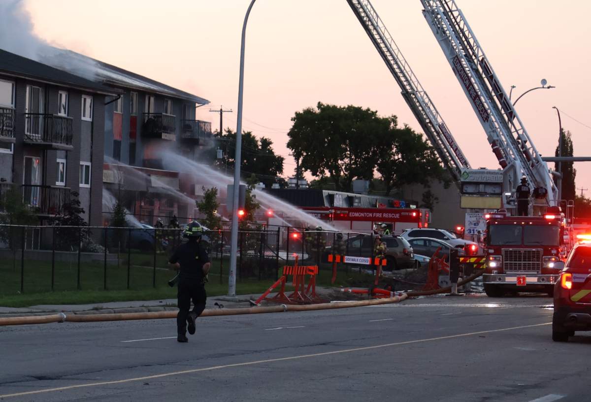 Fire crews respond to a fatal blaze at a mixed-use residential and commercial building at 13126 82 St. in northeast Edmonton on Monday, July 13, 2026.
