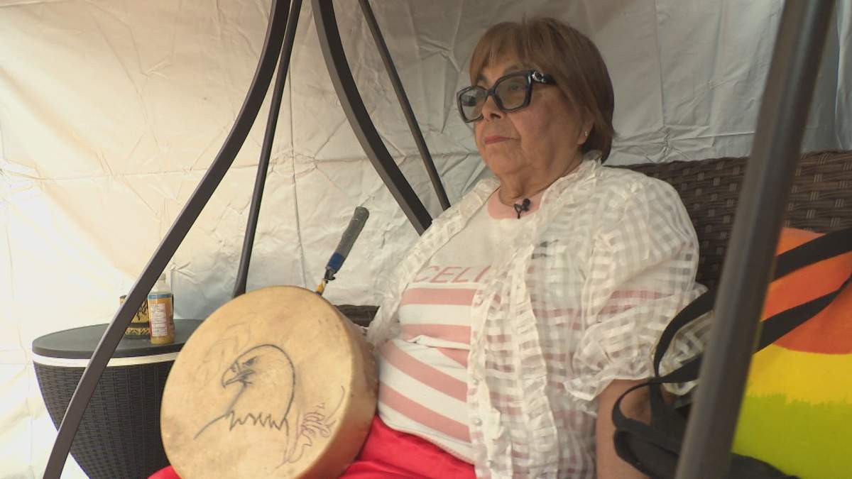 Beverley Courchene holds a drum her daughter, Leah Keeper, made.