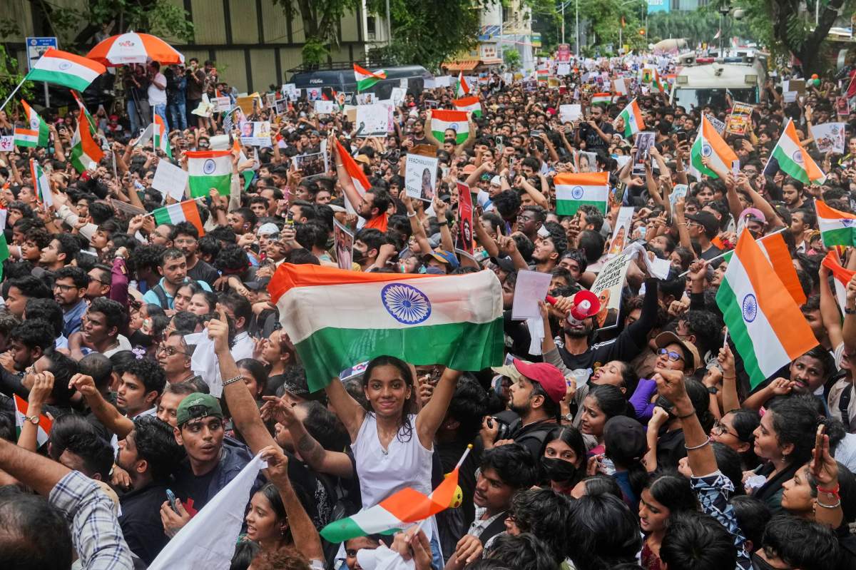 Protesters shout slogans during a demonstration demanding educational reforms as part of the Cockroach Janta Party's ongoing protest movement in Mumbai, India, Friday, July 24, 2026. (AP Photo/Rafiq Maqbool)