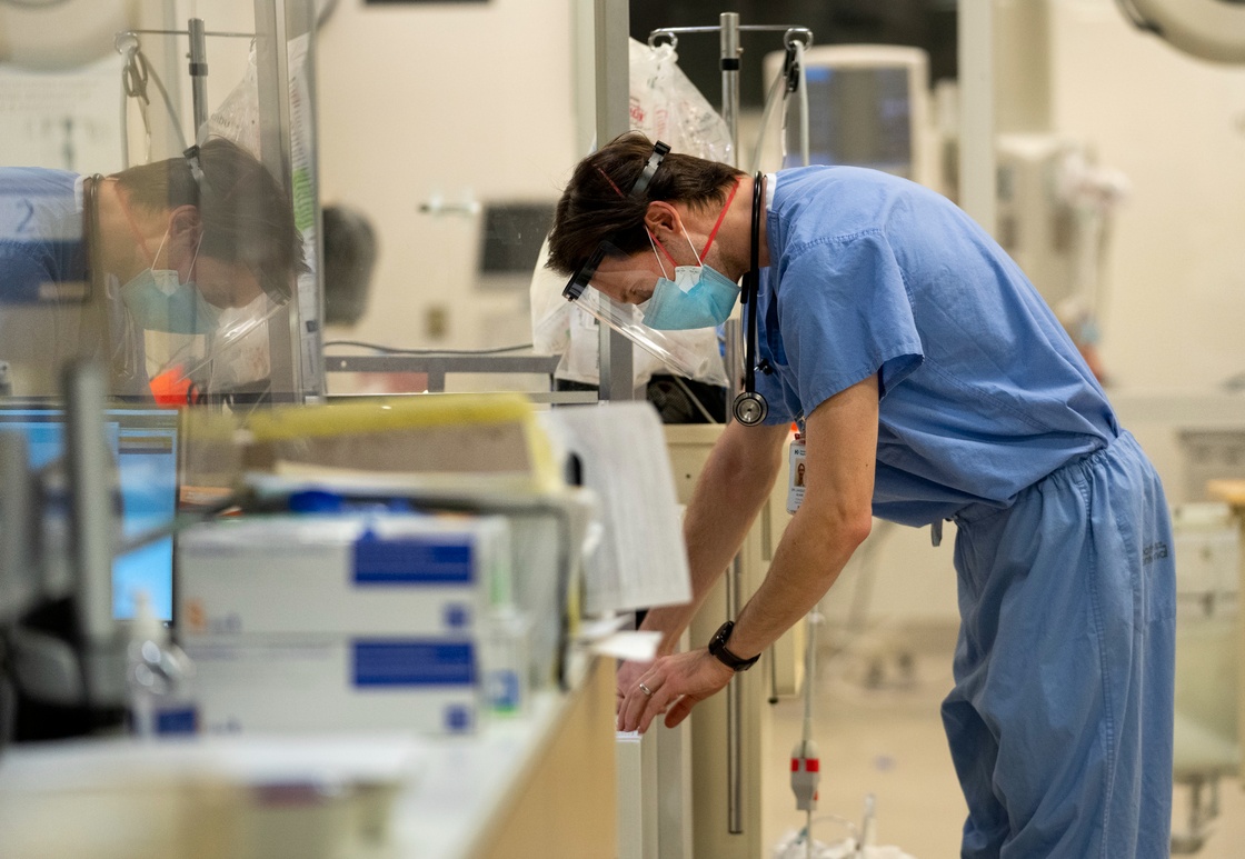 Emergency room physician looks a paperwork while providing care for patients in the emergency room at the Humber River Hospital during the COVID-19 pandemic in Toronto on Tuesday, January 25, 2022. THE CANADIAN PRESS/Nathan Denette