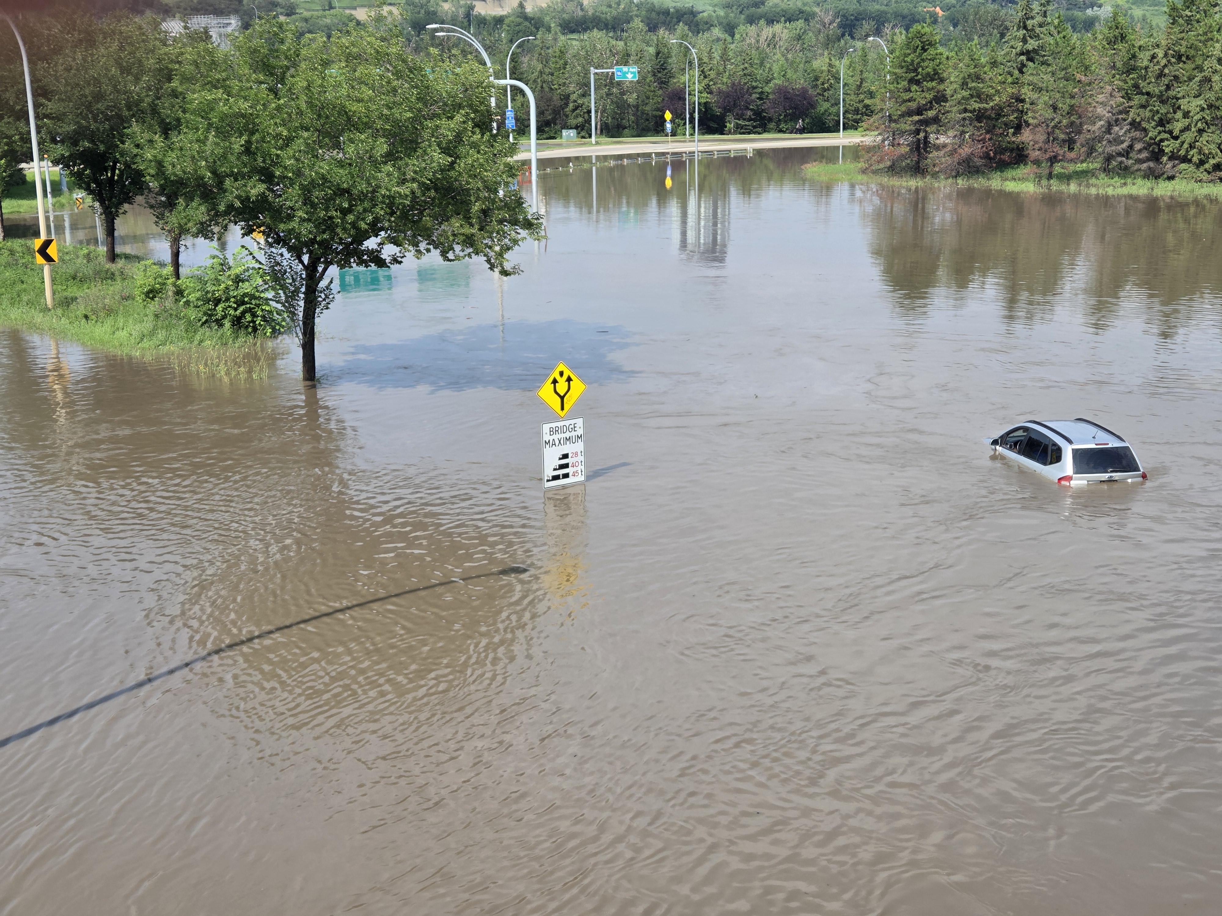The interchange of Connors Road, Scona Road and 98 Avenue was shut down due to massive flooding from an afternoon storm in Edmonton on Monday, July 27, 2026.