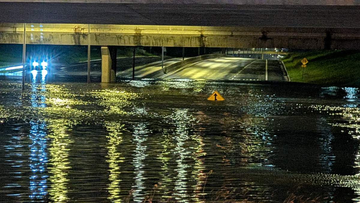 Whitemud Drive flooded under the 170 Street overpass in west Edmonton on Saturday, July 25, 2026.