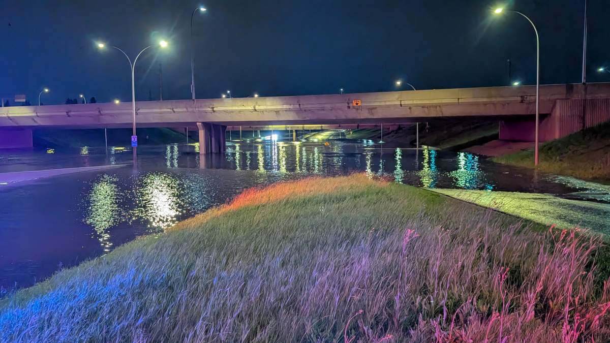 Whitemud Drive flooded under the 170 Street overpass in west Edmonton on Saturday, July 25, 2026.