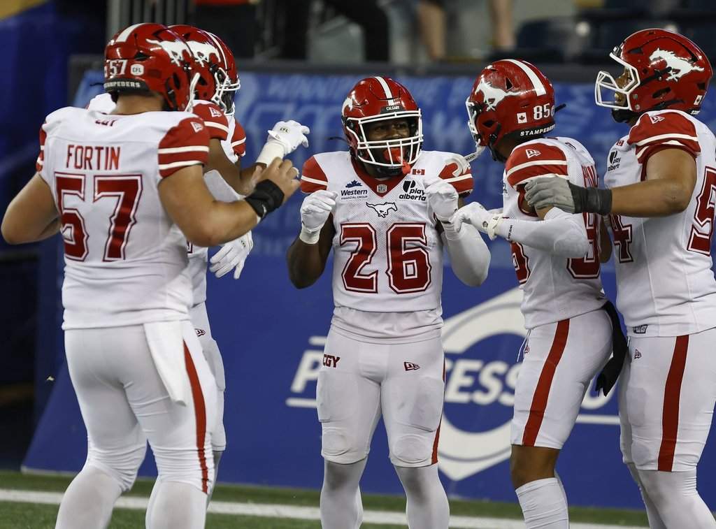 CFL history made: McAllister scores three ways as Stampeders crush Blue Bombers