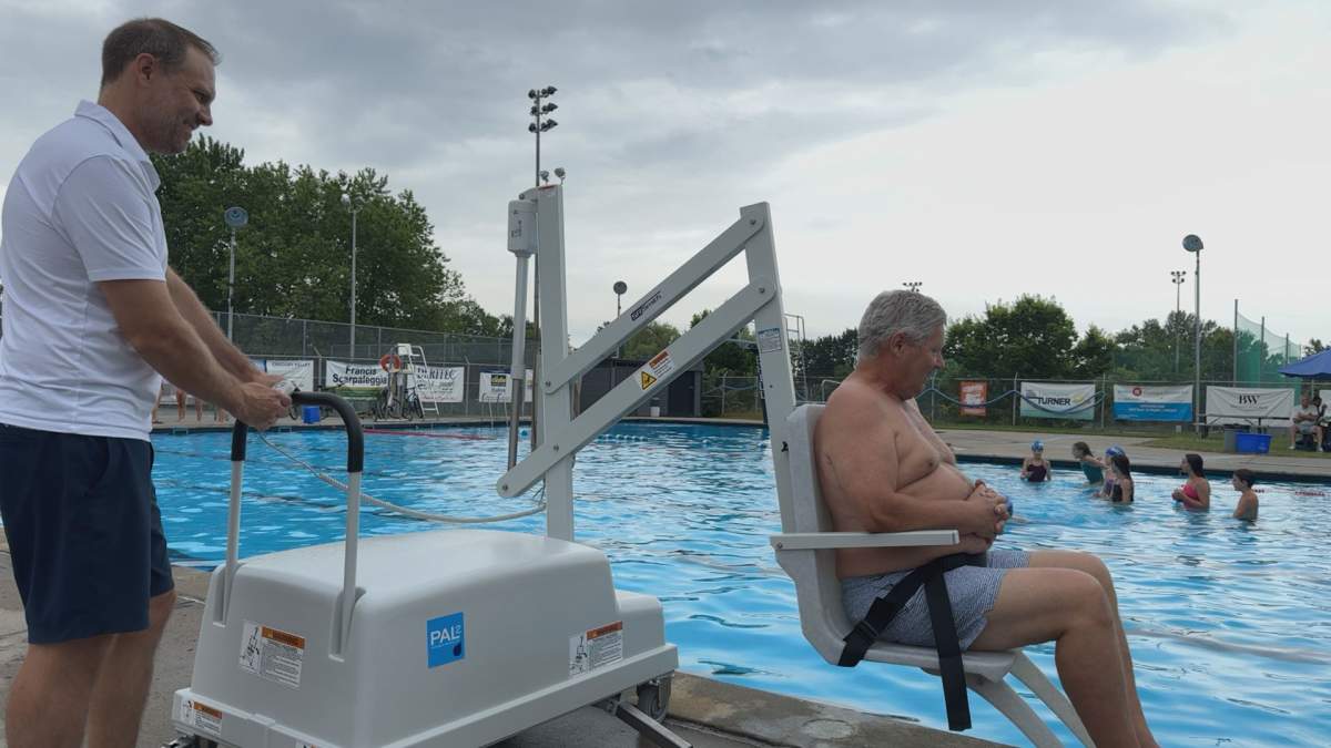 Dave Whipps, Beacon Hill pool president, operates the new chair lift at the pool on July 9, 2026.