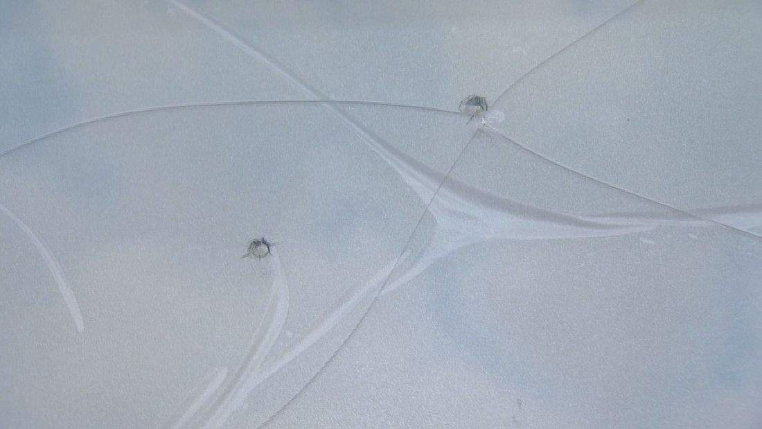 Holes are visible in one of the windows at the mosque.