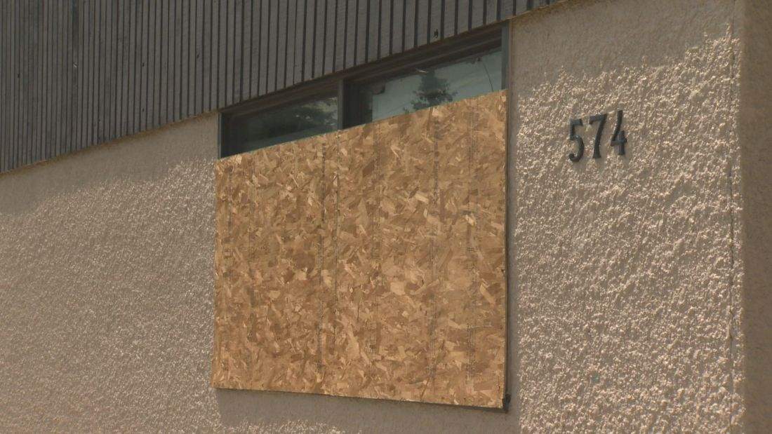 Windows are boarded up at the Islamic centre in Winnipeg.