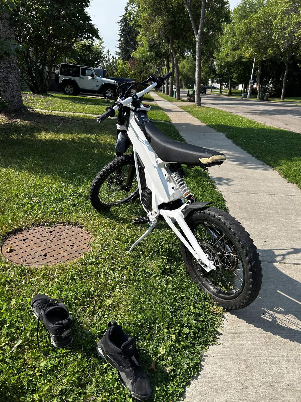 An electric dirt bike involved in a collision with a Fort Bronco SUV in St. Albert, Alta. on Thursday, Aug. 27, 2026.