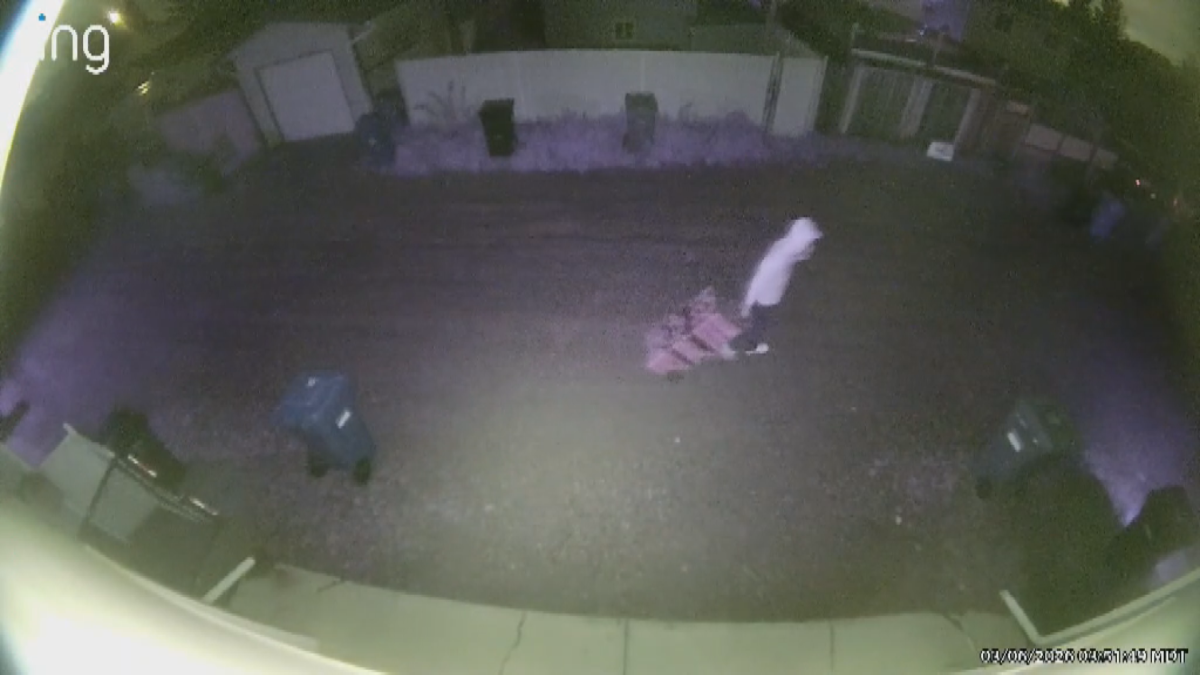 Man dragging toolboxes