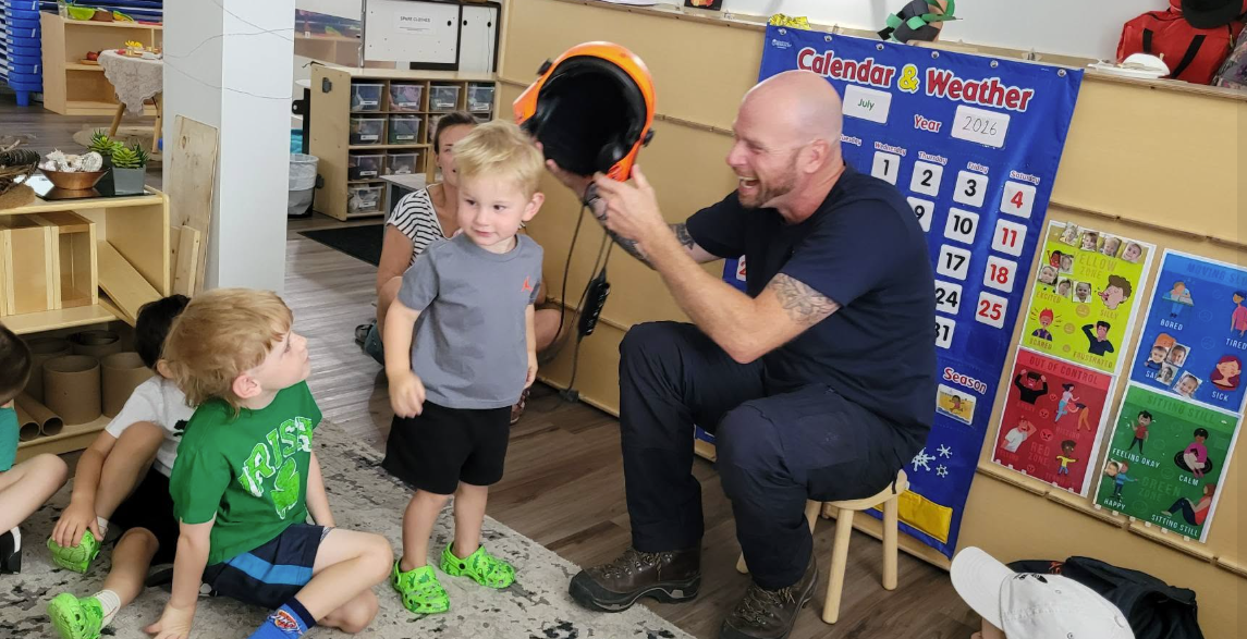 A firefighter helicopter pilot taught some of the preschoolers about fire safety. This happened before the Bald Range Fire.