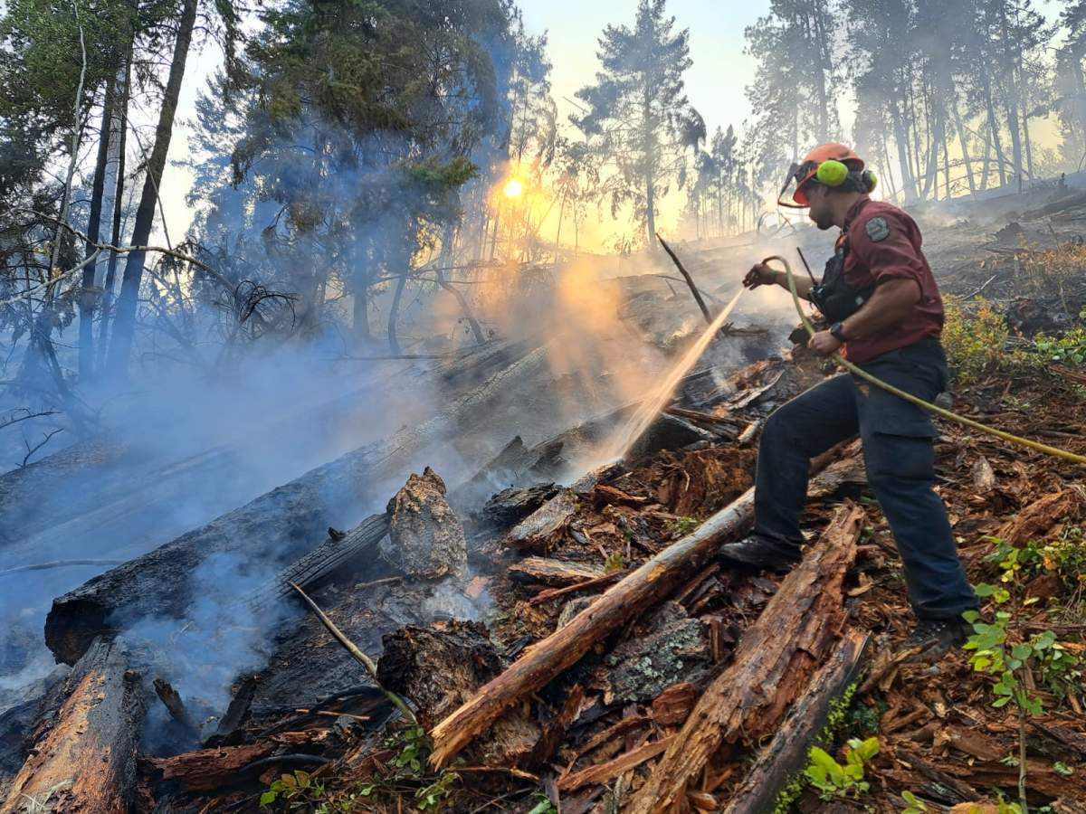A firefighter works on the Quilpituk Creek wildfire, north of West Kelowna.