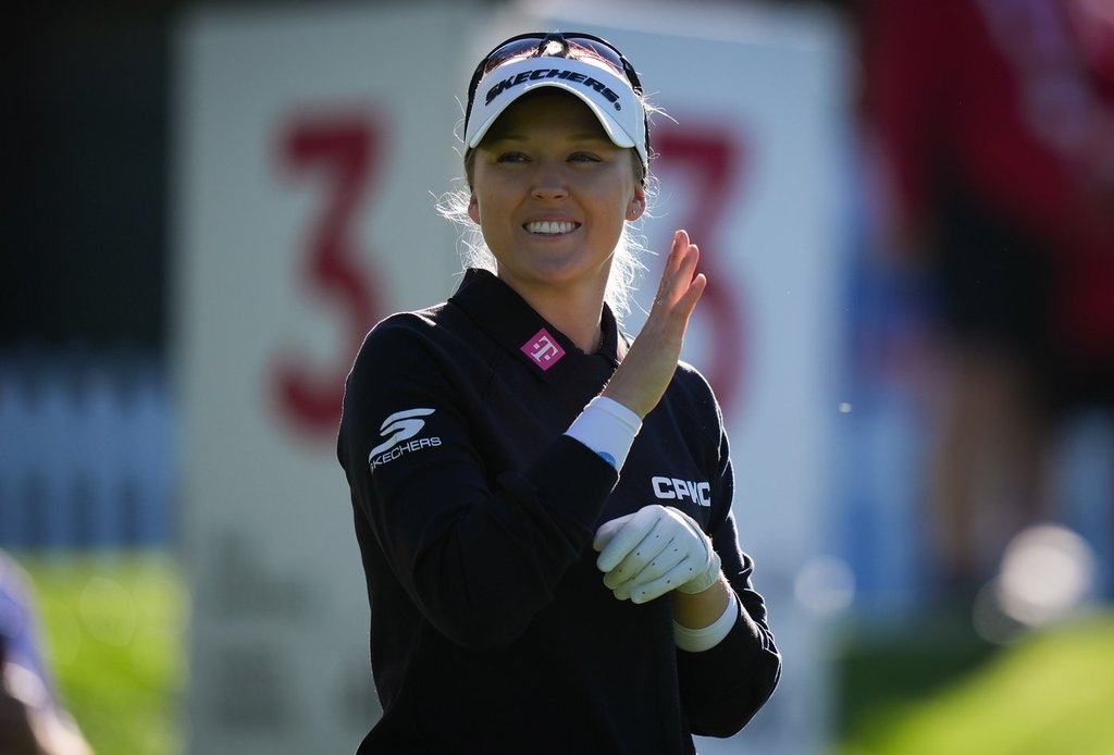 Canada’s Brooke Henderson, of Smiths Falls, Ont., waves to spectators before hitting her tee shot on the third hole during the pro-am at the LPGA CPKC Canadian Women’s Open golf tournament in Edmonton, Alta., on Wednesday, Aug. 19, 2026.