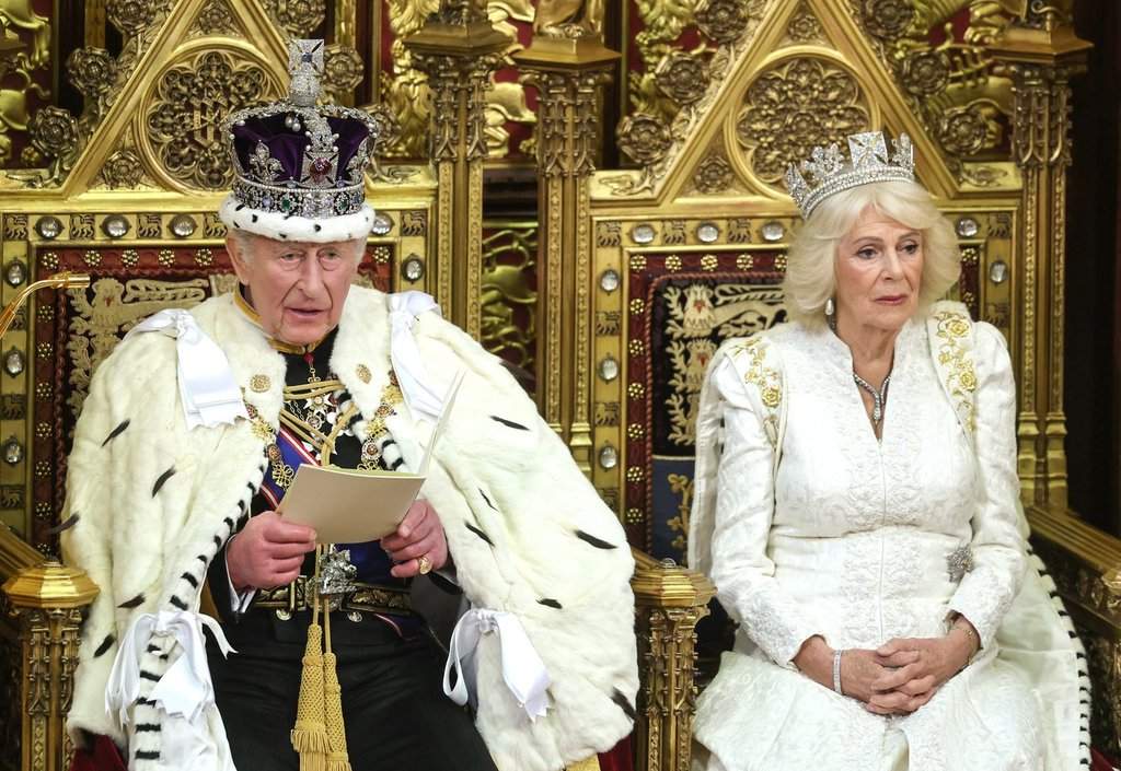 FILE - Britain's King Charles III and Queen Camilla attend the state opening of Parliament at the Palace of Westminster in London, Wednesday, May 13, 2026.