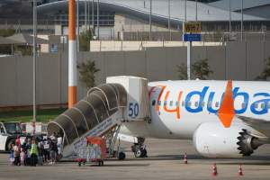 Passengers embark on a FlyDubai aircraft at Ben Gurion International Airport, near Tel Aviv, Israel, Wednesday, Sept. 30, 2026. (AP Photo/Ariel Schalit)