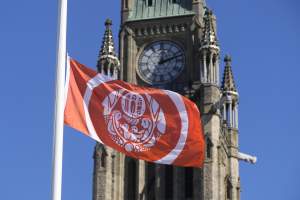 The Survivors' Flag flies on Parliament Hill during the National Day for Truth and Reconciliation in Ottawa, on Tuesday, Sept. 30, 2025. THE CANADIAN PRESS/Adrian Wyld