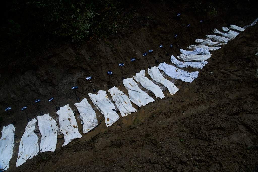 Row of bodies of flash flood victims are laid for mass burial in Kathmandu, Nepal, Tuesday, Sept. 1, 2026.