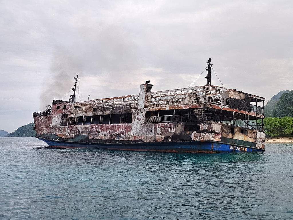 The remains of the ferry MV June Aster are seen following a fire that broke out aboard the vessel in waters off Palawan, Philippines, on September 10, 2026.