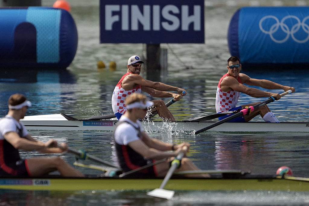 Croatia’s Martin Sinkovic (TOP L) and Croatia’s Valent Sinkovic cross the finish line in first place as they compete for the gold in the men’s pair final rowing competition at Vaires-sur-Marne Nautical Centre in Vaires-sur-Marne during the Paris 2024 Olympic Games on August 2, 2024.