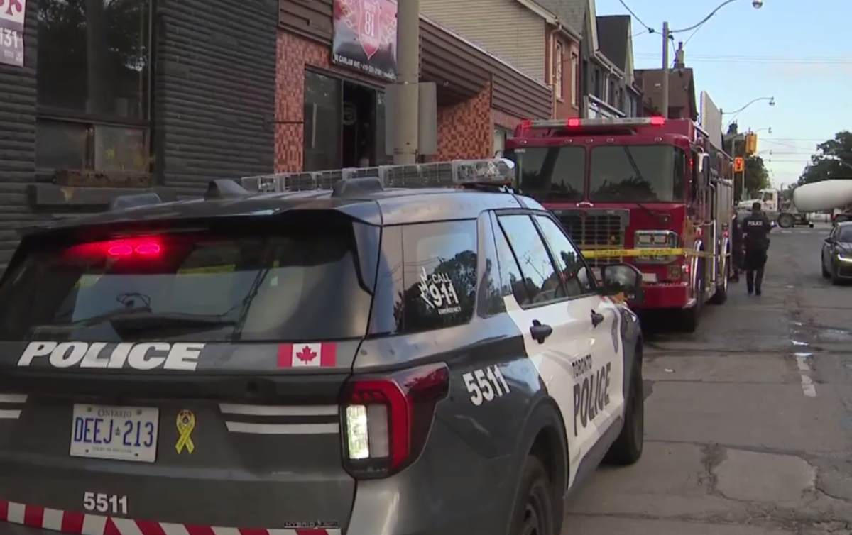 Police and firefighters on the scene of a blaze at Carlaw Ave. and Eastern Ave.