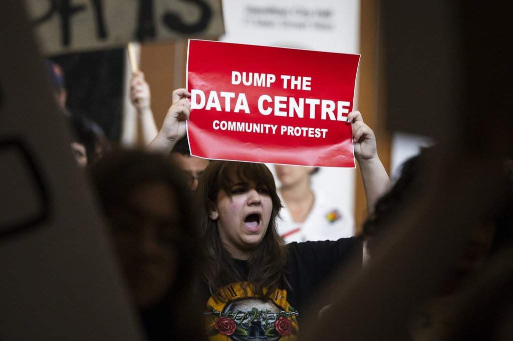 A group of allied New Brunswick residents opposing what could be the first hyperscale data centre in Atlantic Canada say theyâve uncovered a proposal for a second, smaller one nearby. People in opposition to AI data centres demonstrate outside the council chambers at city hall in Hamilton, Wednesday, July 15, 2026. THE CANADIAN PRESS/Nick Iwanyshyn.