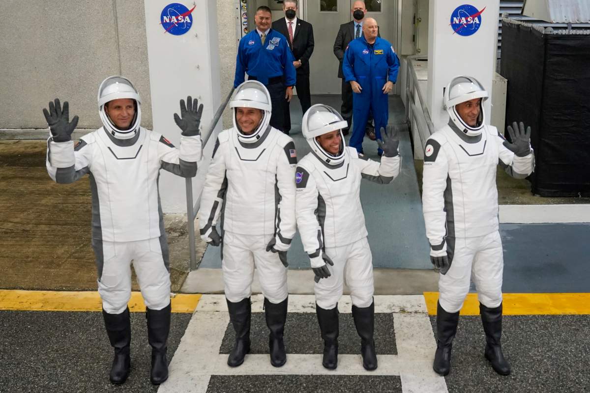 Astronauts, from left, Joshua Kutryk, of Canada, pilot Luke Delaney, commander Jessica Watkins and Cosmonaut Sergey Teteryatnikov, of Russia leave the Operations and Checkout Building at the Kennedy Space Center in Cape Canaveral, Fla., Thursday, Oct. 1, 2026.