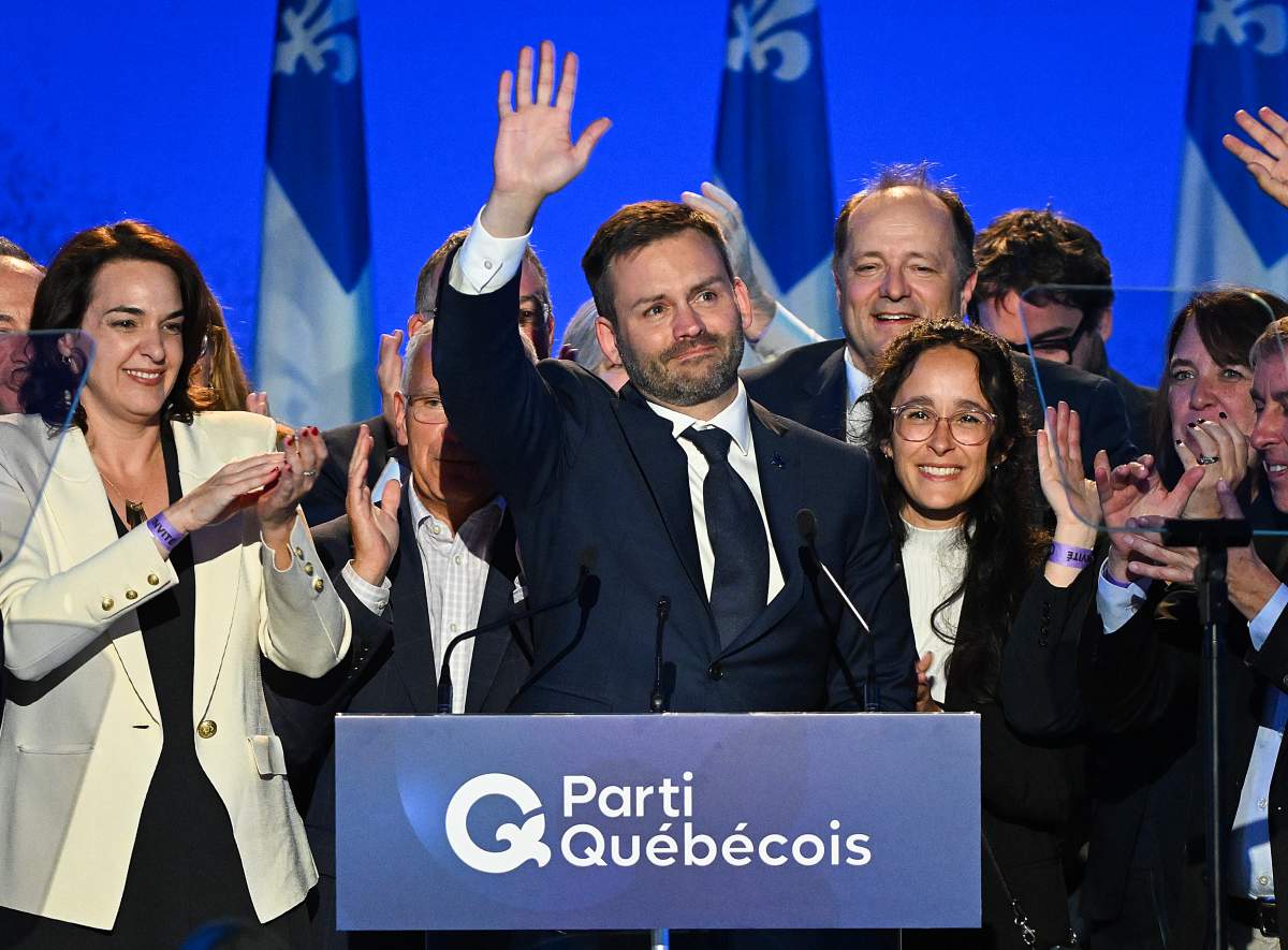 Parti Quebecois Leader Paul St-Pierre Plamondon waves to supporters after winning the provincial election in Montreal, on Monday, Oct. 5, 2026.