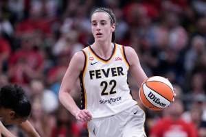 Indiana Fever guard Caitlin Clark (22) plays against the New York Liberty in the second half of a WNBA basketball game in Indianapolis, Tuesday, Aug. 11, 2026. (AP Photo/Michael Conroy)