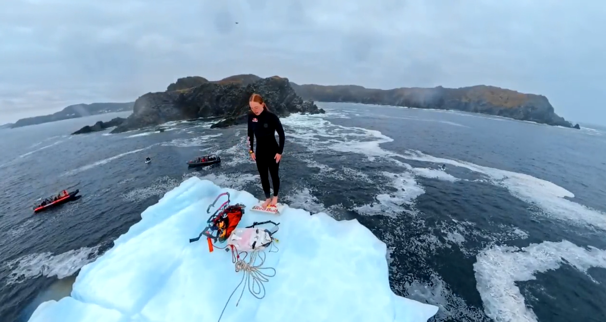 Montreal-based cliff diver Molly Carlson prepares to make a roughly 15-metre, or 50-foot, plunge from an iceberg off the coast of Twillingate, Newfoundland.