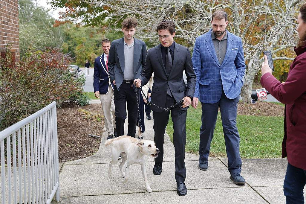 Braden Peters arrives with a dog to Orleans District Court on October 22, 2026 in Orleans, Massachusetts.