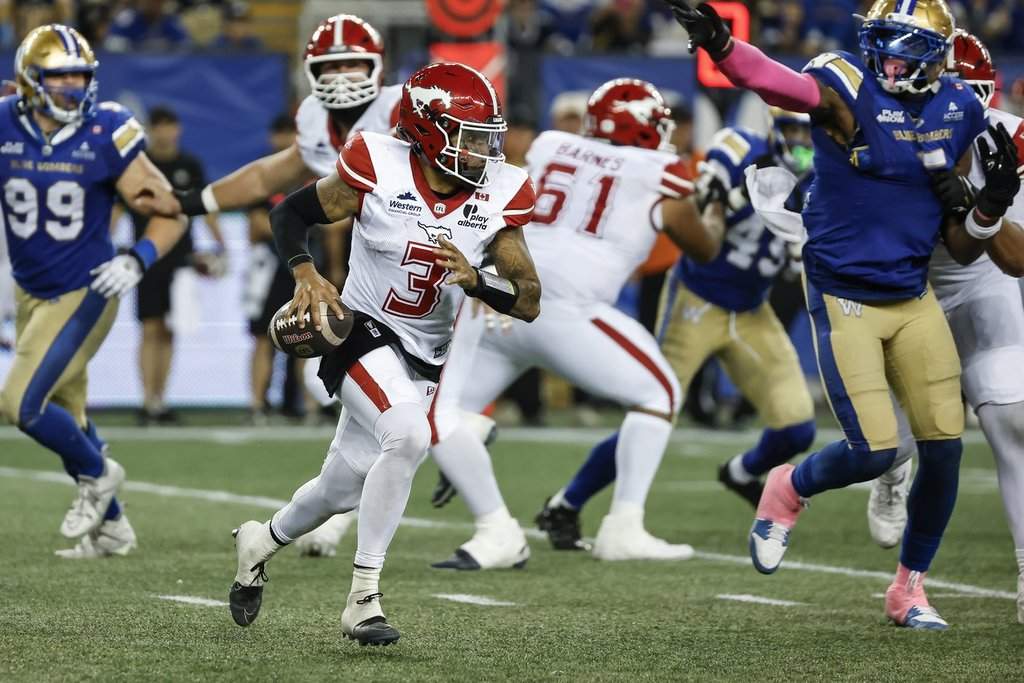 Calgary Stampeders quarterback Vernon Adams Jr. (3) looks for a receiver during second half CFL football action against the Winnipeg Blue Bombers in Winnipeg on Saturday, Oct. 10, 2026. THE CANADIAN PRESS/John Woods.
