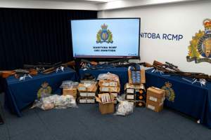 13 firearms and approximately 20,000 rounds of ammunition were seized after the search of two West St. Paul homes last month, the Manitoba RCMP said in a news release.